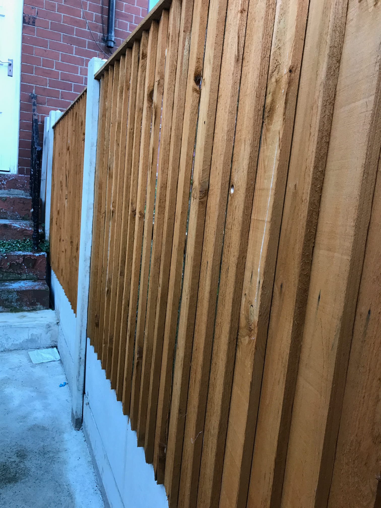 New timber feather-edge fencing on concrete posts