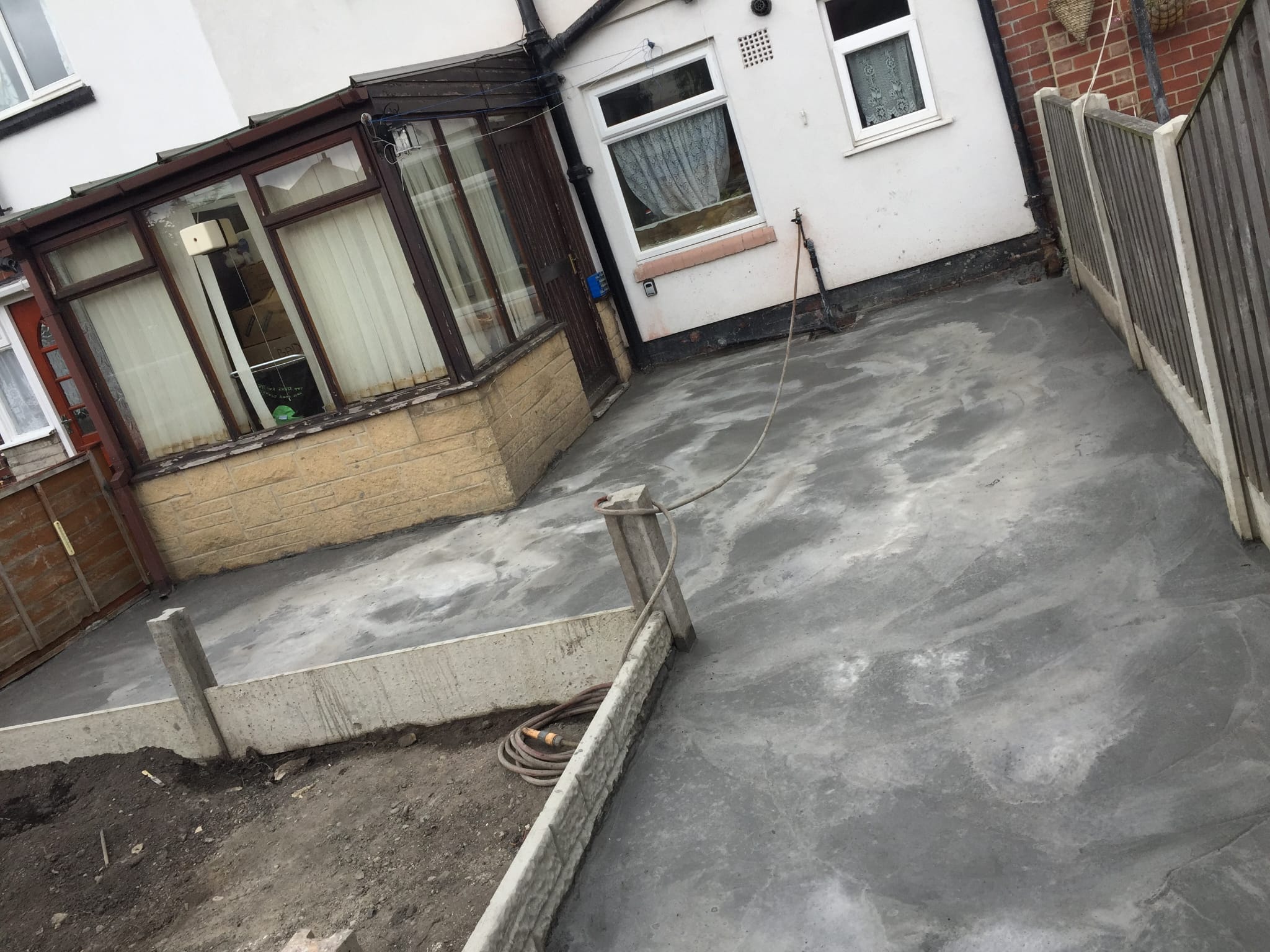New concrete yard and boundary fencing